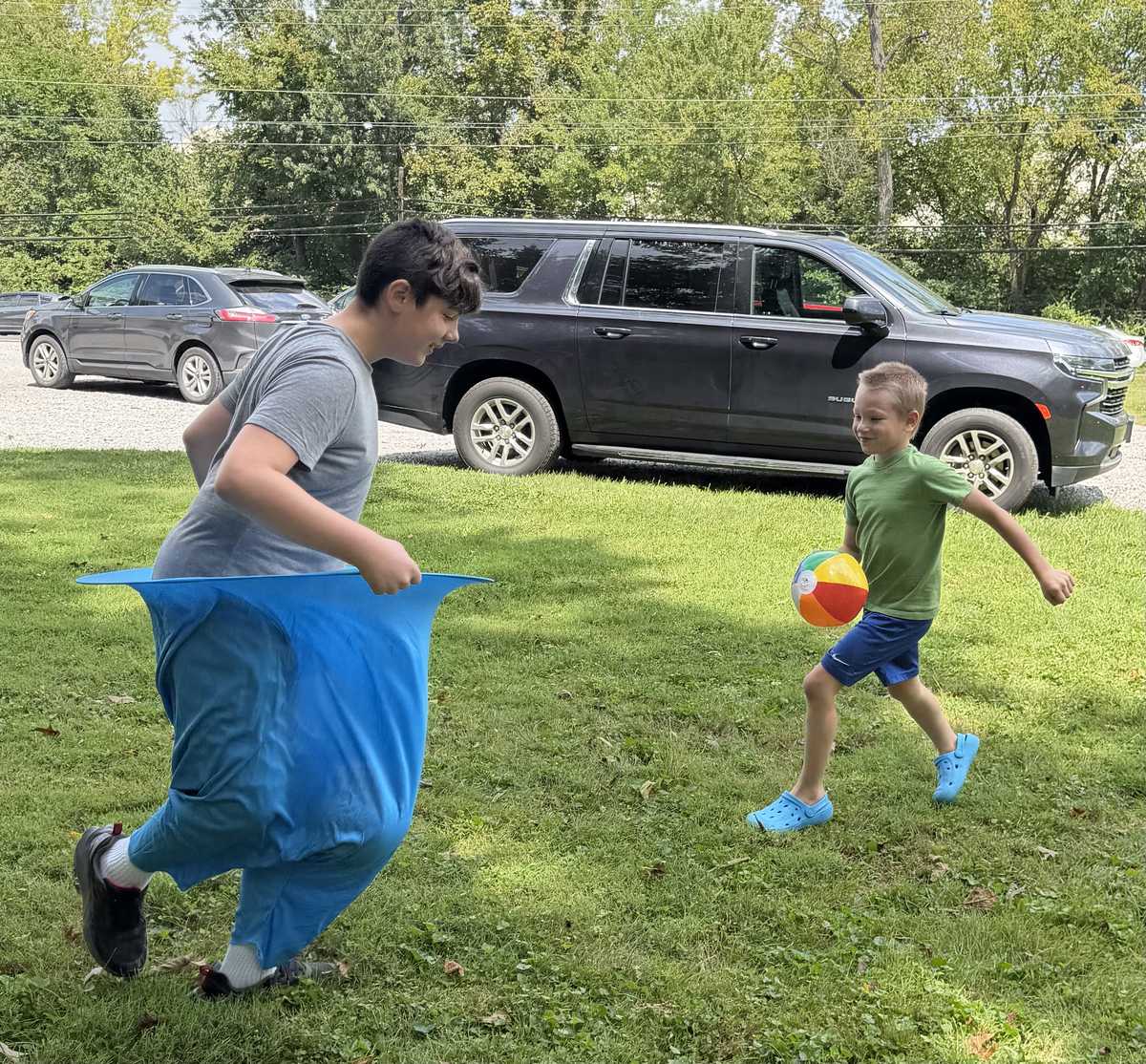 Kids ministry group playing an outdoor game near the church